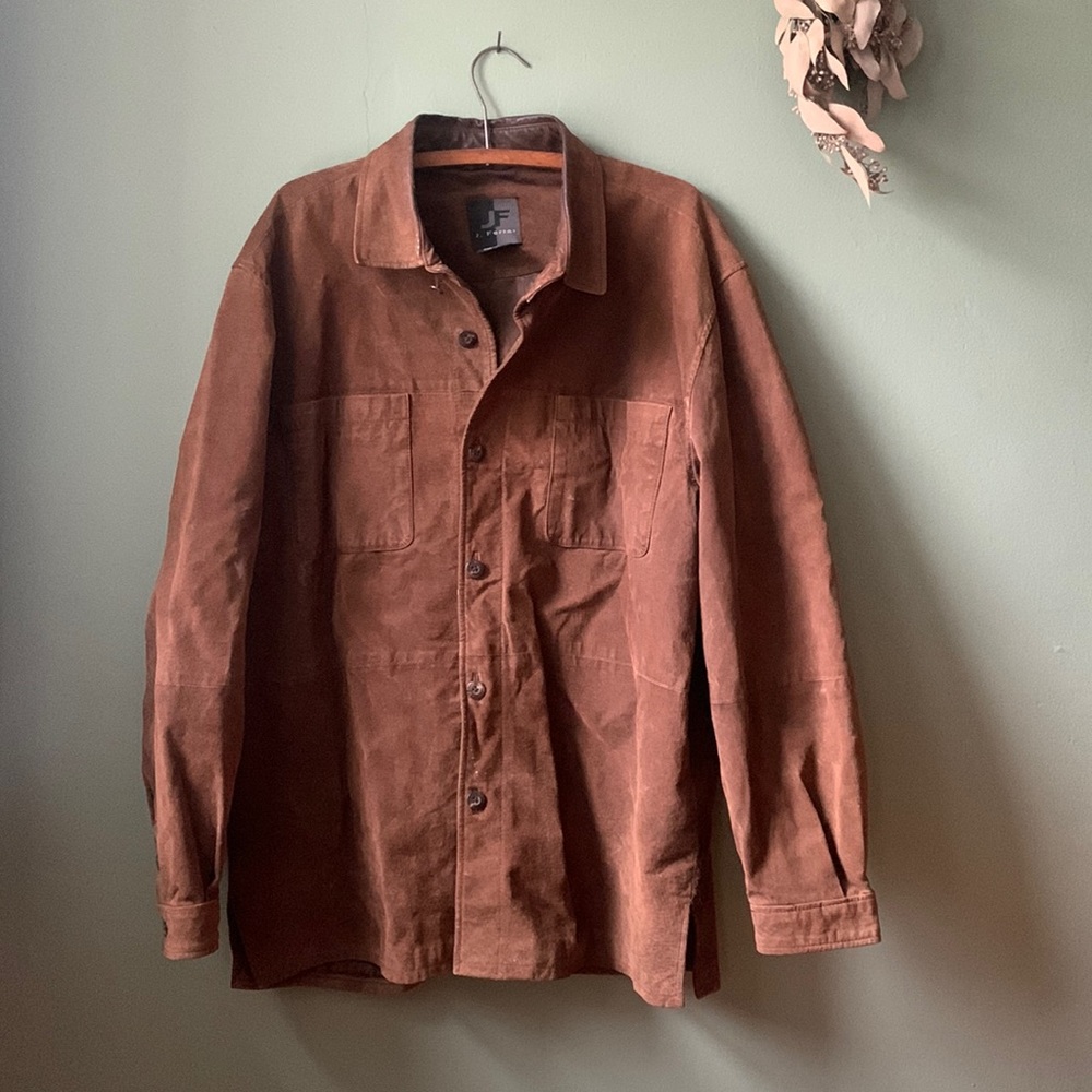 Brown suede jacket with two pockets on chest. Lightweight. Minor imperfections.